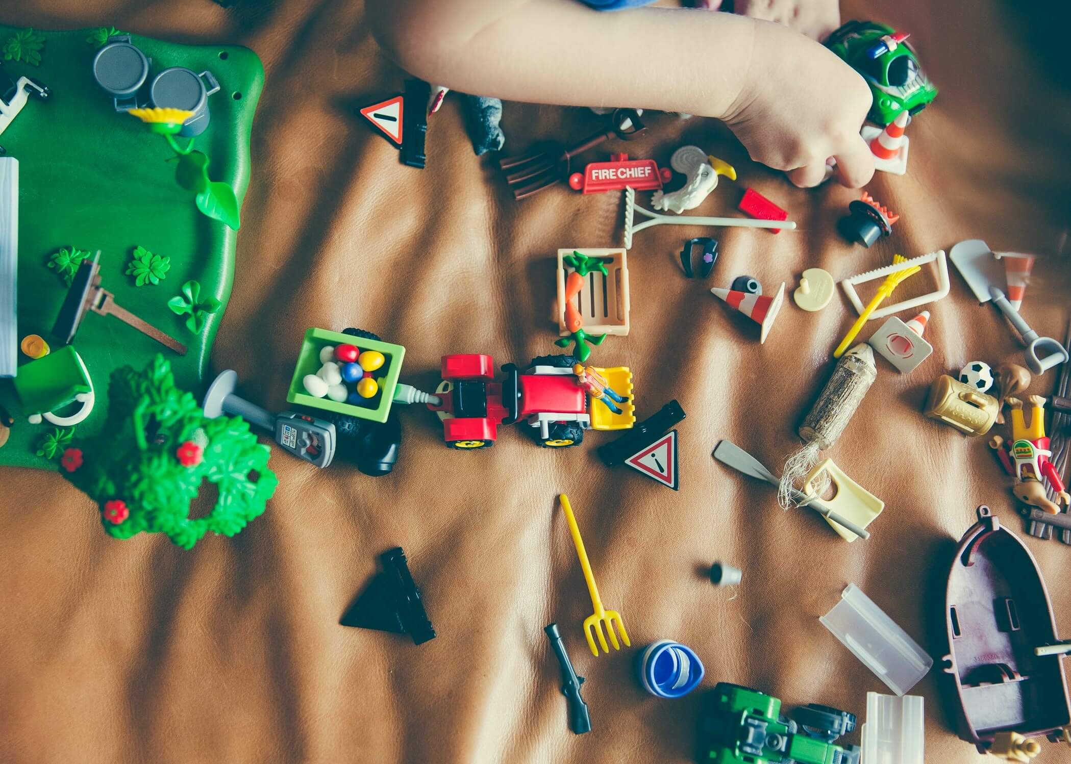 Child playing with toys for car trip