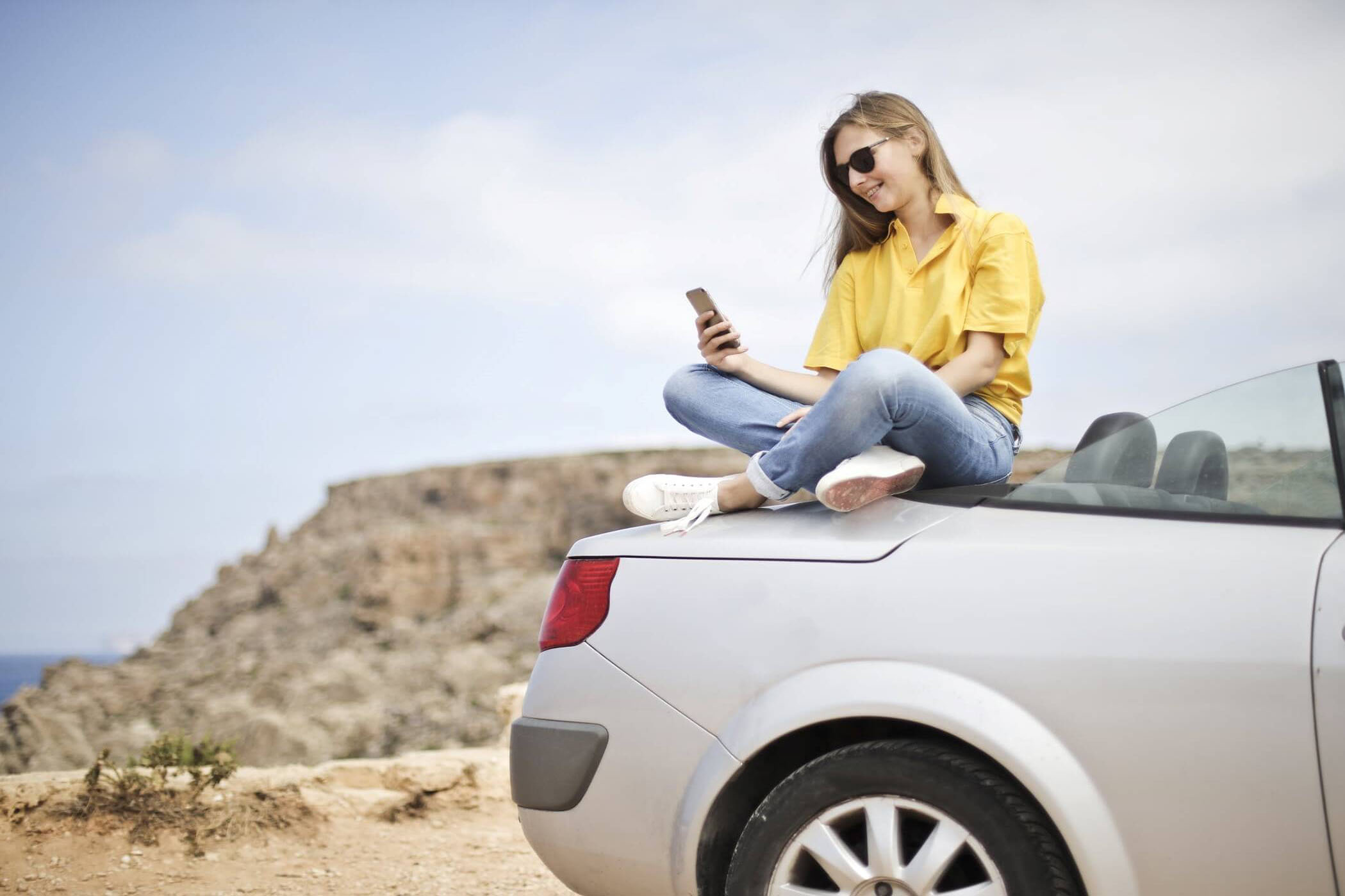 Girl Preparing Road Trip on Car