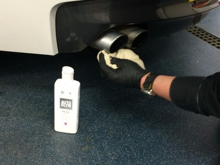 Cleaning car exhaust with Autoglym Metal Polish