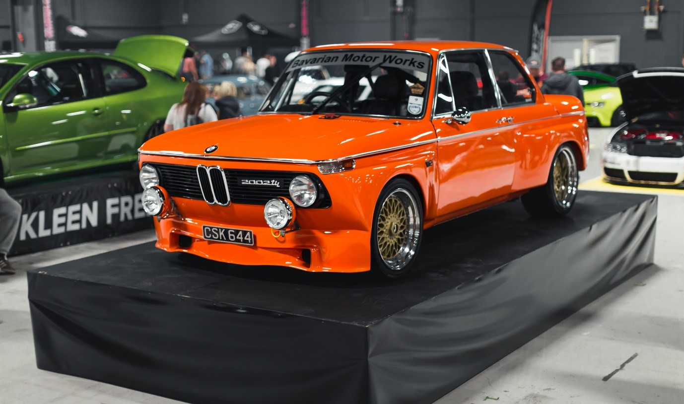 Classic orange BMW car on the sShow and Shine stand at FittedUK